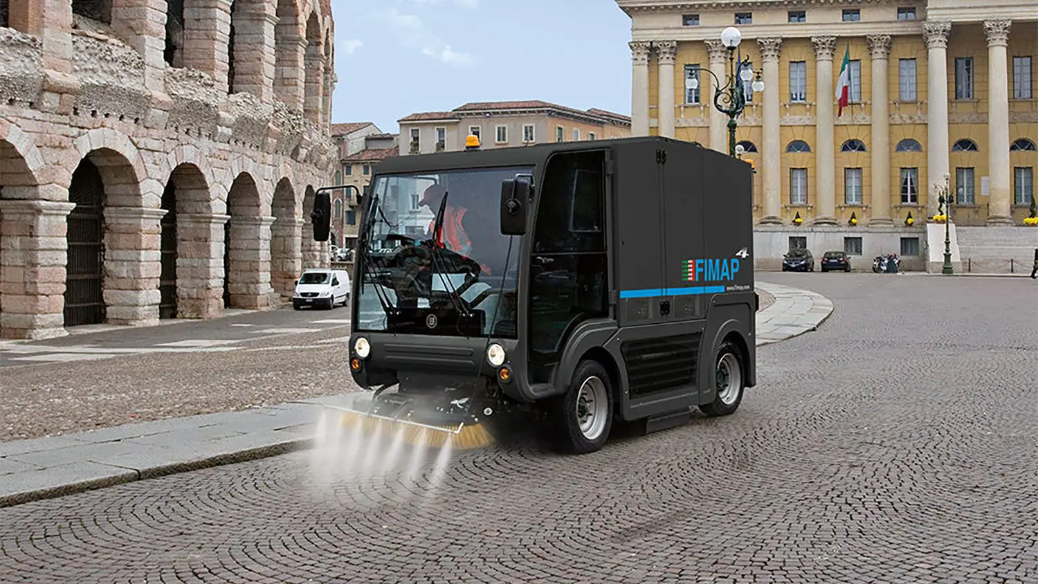 Truck-mounted street sweeper cleaning a public road